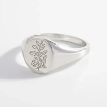 Elegant sterling silver signet ring with engraved floral botanical design