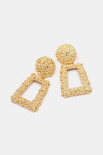 Gold textured zinc alloy dangle earrings with circular accents
