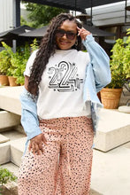 Woman in Simply Love round neck short sleeve t-shirt, denim jacket, polka dot pants