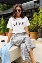 Woman in Simply Love Ciao Round Neck T-Shirt with striped paper-bag pants