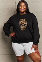 Black drop shoulder graphic sweatshirt with leopard skull and white biker shorts