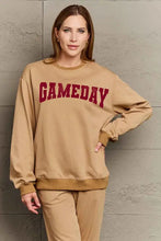 Full size gameday graphic sweatshirt in tan with red GAMEDAY text