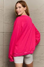 Hot pink oversized graphic drop shoulder sweatshirt with white bike shorts