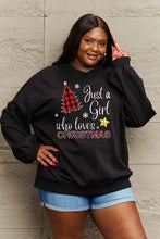 Black long-sleeved graphic sweatshirt with plaid Christmas tree design