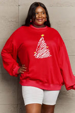 Red long-sleeved full size graphic sweatshirt with white Christmas tree and yellow stars
