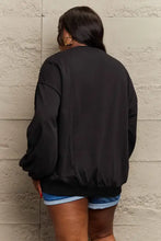 Womens black long sleeve bomber jacket with graphic sweatshirt design