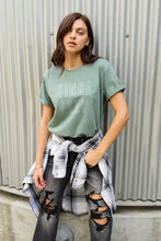 Woman in Simply Love lazy round neck t-shirt and jeans