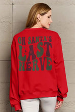 Simply Love red graphic long sleeve sweatshirt with ON SANTAS LAST NERVE text
