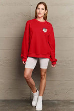 Red Simply Love graphic long sleeve sweatshirt with chest emblem