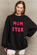 Black oversized Simply Love full size mom ster graphic sweatshirt with dripping pink MOM STER letters
