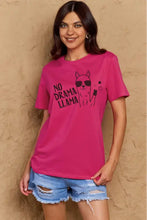 Woman in Simply Love cotton tee with drama llama graphic and denim shorts