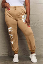 Simply Love tan sweatpants with white daisy skull graphics