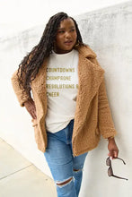 Woman in Simply Love tan teddy fleece jacket with long sleeve length and distressed jeans