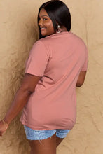 Simply Love halloween theme graphic short sleeve t-shirt with dusty rose oversized style, distressed denim shorts, and hoop earrings