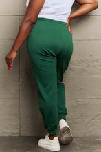 Simply Love womens dark green jogger sweatpants with white top and sneakers