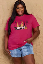 Simply Love womens Halloween theme short sleeve t-shirt in dusty rose with cat and witch design, plus-size, paired with denim shorts