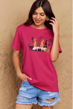 Simply Love womens Halloween theme short sleeve T-shirt in dusty rose with magenta witch graphic, distressed denim shorts, hoop earrings