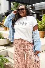 Plus-size woman in Simply Love worship short sleeve set with wide-leg pants