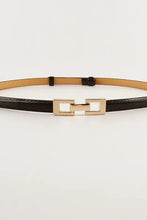 Thin black skinny belt with gold rectangular buckle