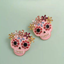 Two pink skull rhinestone alloy earrings with colorful gems and pearls