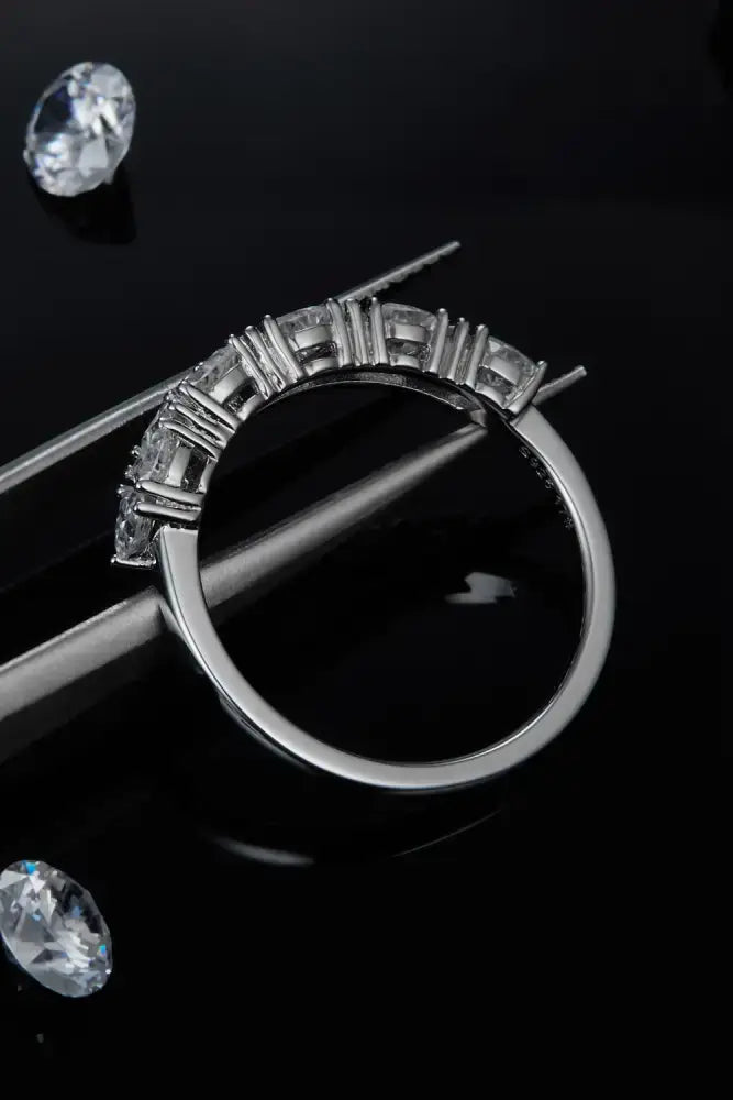 Elegant 1 carat moissanite sterling silver ring with sleek silver band and rectangular-cut clear stones