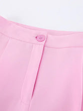 Pink pleated wide-leg trousers with matching waistband button from Sleeveless Blazer Set