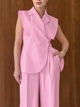 Sleek sleeveless pink blazer with asymmetrical design in Sleeveless Blazer & Wide Leg Pants Set