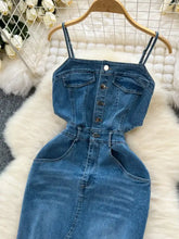 Blue denim sleeveless frayed hem dress with front button closure and side pockets featuring a slit design