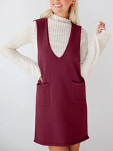 Maroon sleeveless knit dress with v-neckline and front pockets