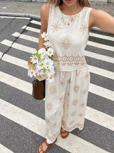 Cream-colored sleeveless top with gold embroidery and lace trim from set