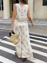 Sleeveless top and wide-leg pants set with beige floral embroidery