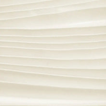 Cream-colored pleated fabric folds in Sleeveless Vest and Pleated Maxi Skirt Set