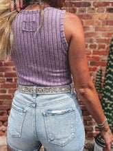 Back view of purple slim ribbed mineral wash tank top with ribbed texture and small patch pocket