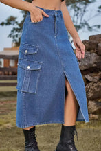 Blue midi denim skirt featuring large cargo pockets and a front slit for casual and stylish wear