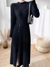 Slit front mock neck long sleeve knit dress, black with pleated skirt