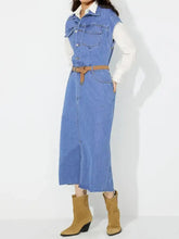 Blue denim dress featuring slit half button collared neck and frayed hemline in a sleeveless design