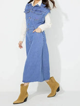 Blue denim slit half button collared neck cap sleeve dress styled with white shirt and tan ankle boots