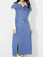 Blue denim dress featuring a half button collared neck and side slit in a sleeveless design for casual wear