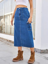 Blue slit midi denim skirt with button closure and two large side pockets made from classic denim fabric
