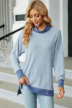 Light blue slit mock neck long sleeve tunic with dark blue cuffs