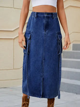 Blue denim high waist midi skirt with large side slit pockets and front zipper closure for stylish wear