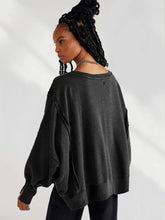 Black distressed long-sleeve oversized sweatshirt with slit round neck and dropped shoulder