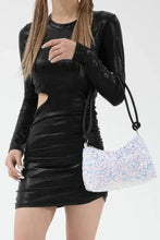 Silver sequin crossbody bag with drawstring closure in polyester