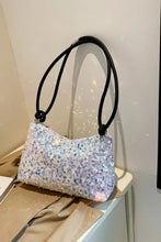 Silver sequined shoulder bag with black strap in polyester