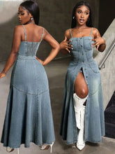 Smocked button front denim cami dress featuring a button-front design, thin spaghetti straps, and a high slit