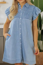 Light blue denim dress with short puffed sleeves and smocked collared neck button-down front design