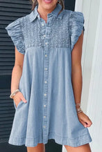 Light blue denim dress with ruffled short sleeves and smocked collared neck button-down front