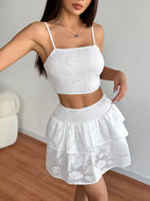 White smocked crop top and matching floral lace tiered mini skirt set