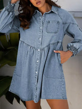 Light blue denim dress with button-front closure smocked cuffs waistband and two front pockets in denim shirt style