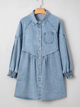 Light blue denim shirt dress with collar button-front closure and smocked cuffs showcasing denim dress features